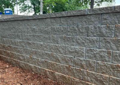 Retaining Wall & Paving Solutions concrete wall project in High Ridge backyard