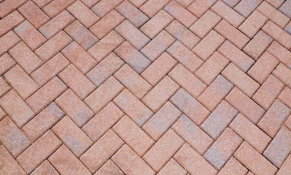 A freshly cleaned and sealed herringbone paver surface showing rich color and even joint lines, demonstrating long-term protection against Missouri’s freeze–thaw cycles.